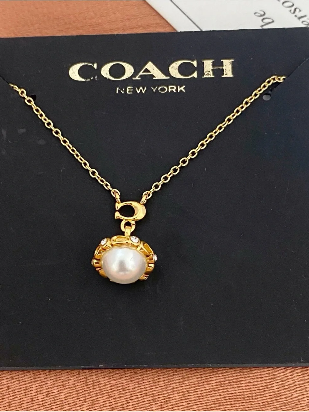 COACH Gold Pearl Charm Necklace - Gold and White